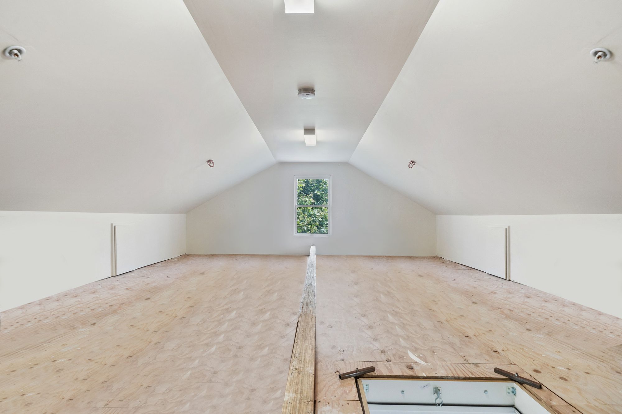 Full floor finished attic space with drop down ladder